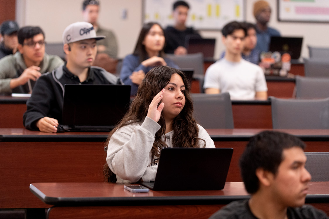 student raising her hand