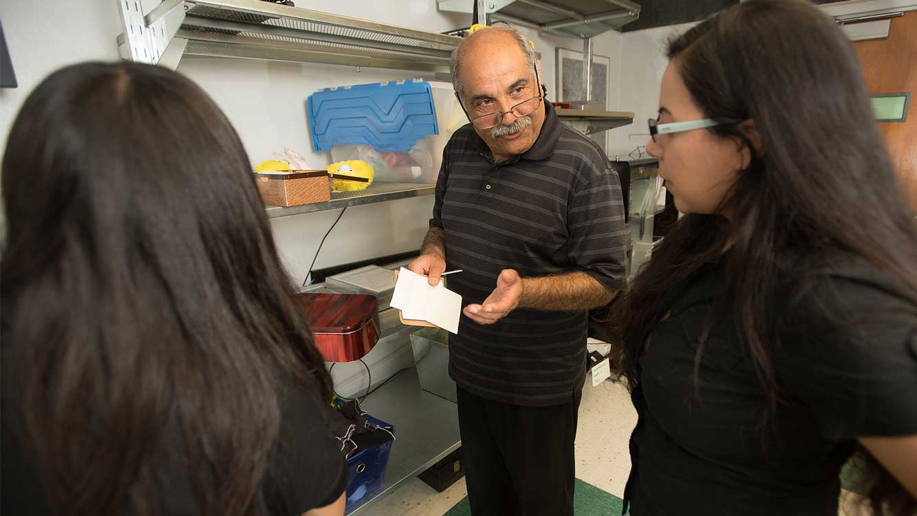 Professor in SCOT lab instructing students