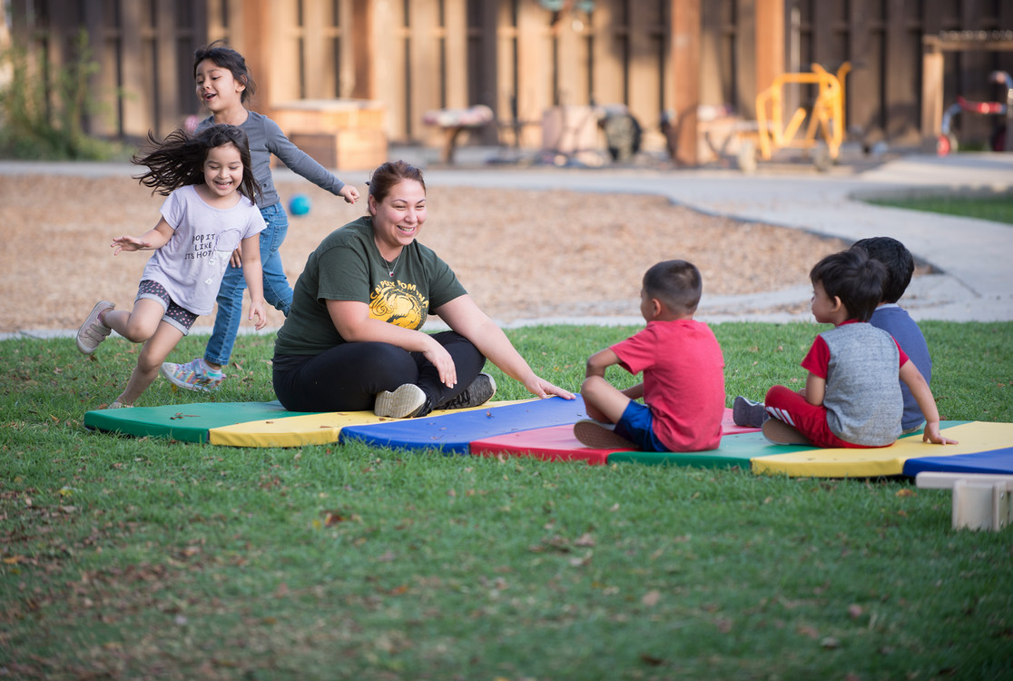 children playing duck duck goose
