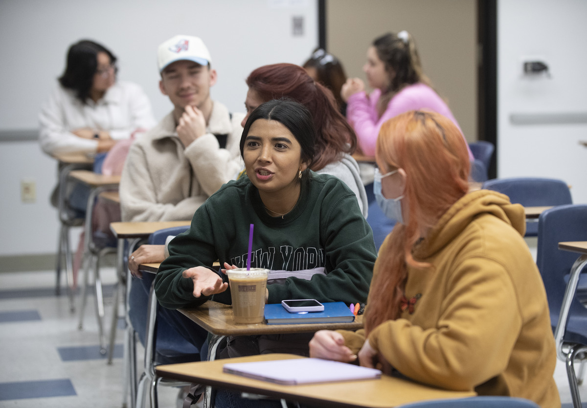 Two female students chatting on the first day of class