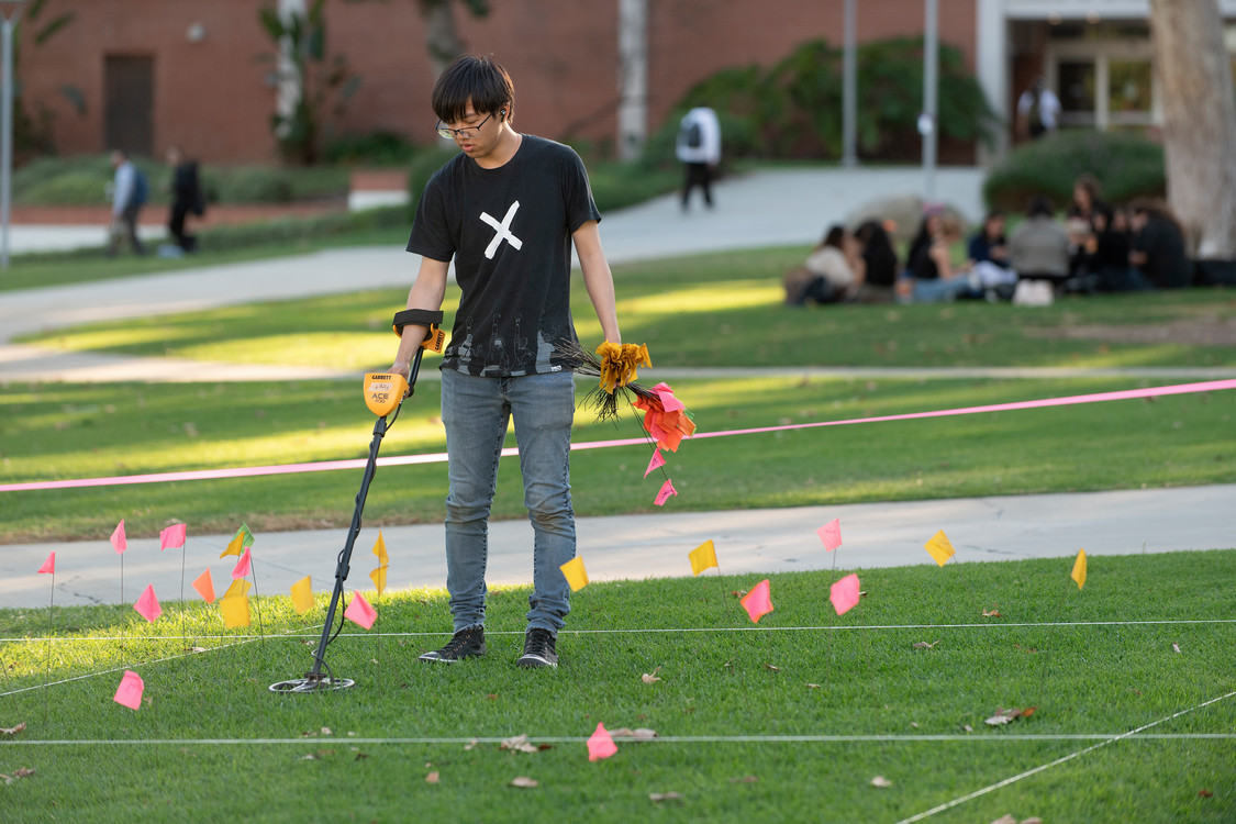 Student using metal detector