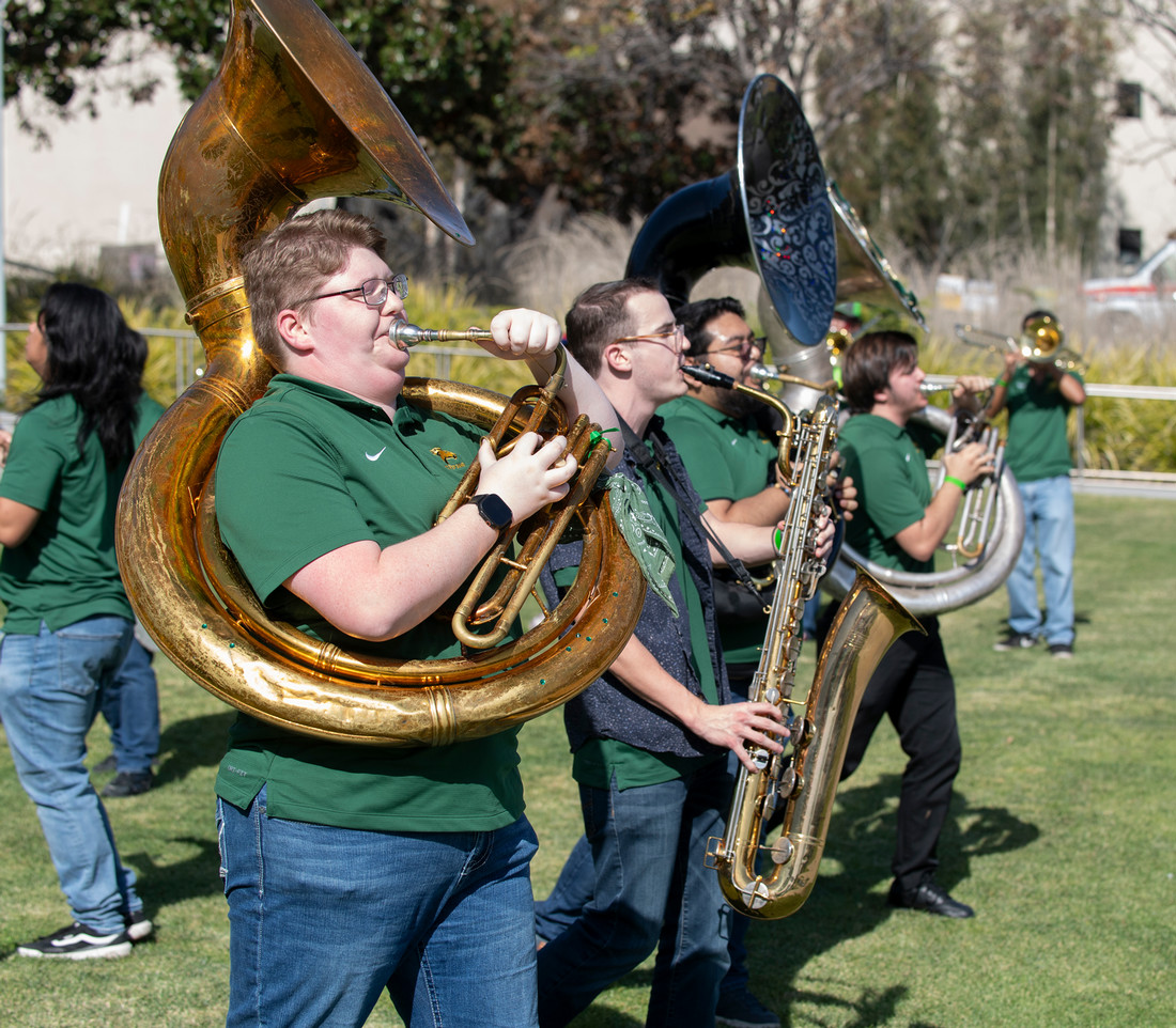 Brass ensemble playing their instruments