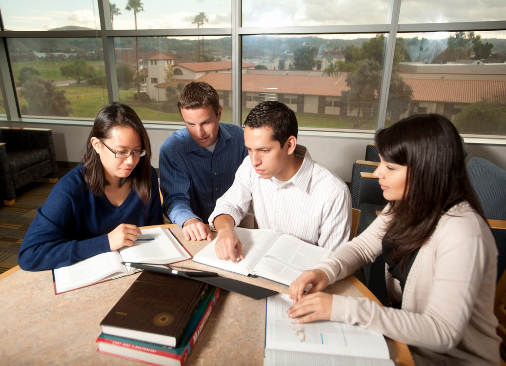 students gathered around a computer