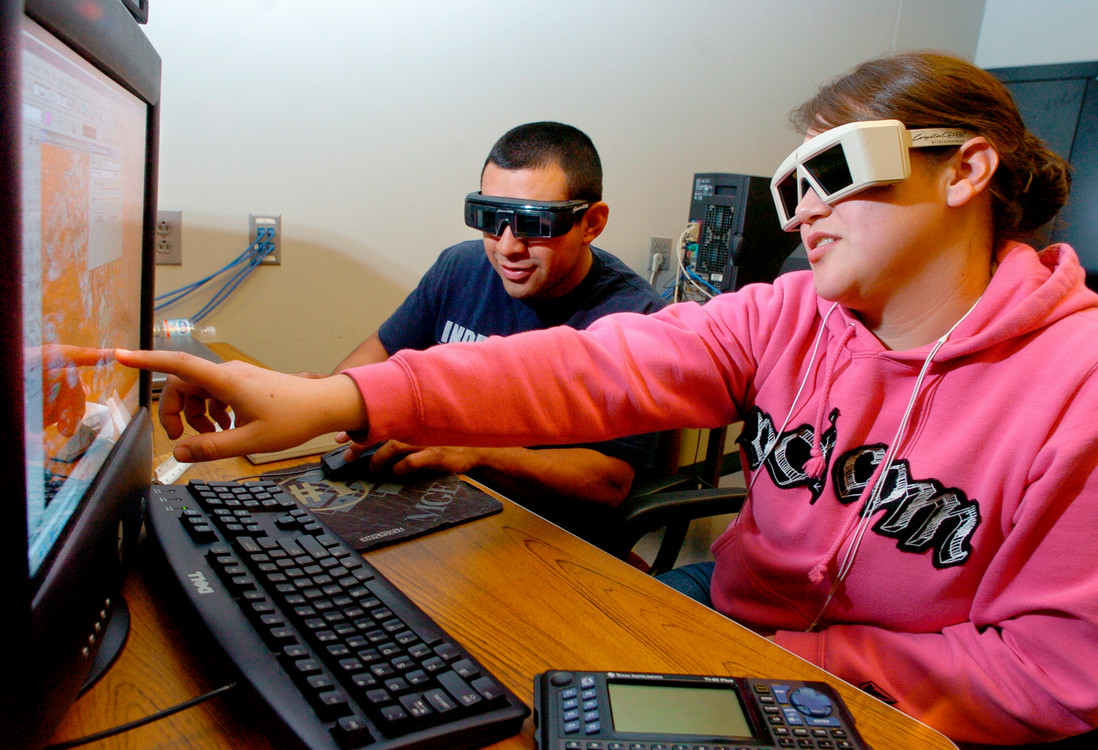 two students in the geospatial lab