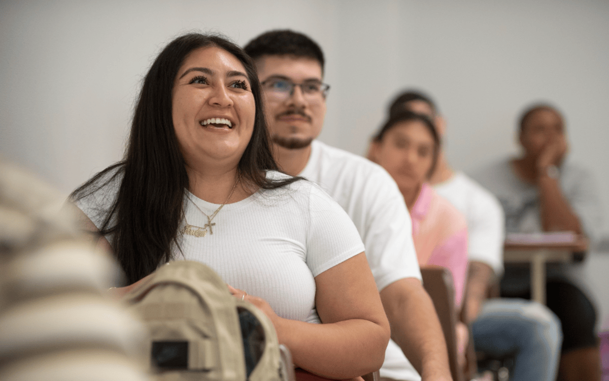 Students smiling during a class lecture