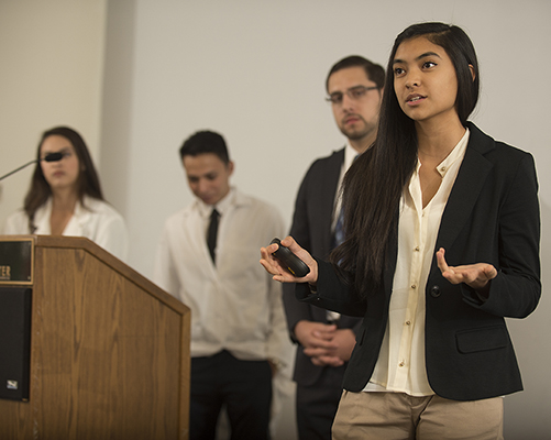 A female sociology student addresses an audience from the dais during CSU Chancellor visit