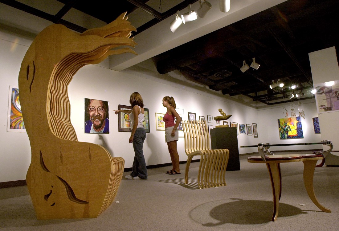 Two visitors admire art in the Kellogg Art Gallery