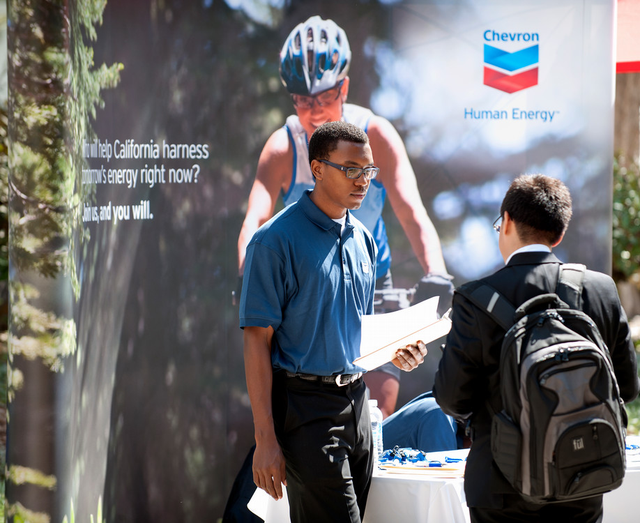 student at a chevron booth