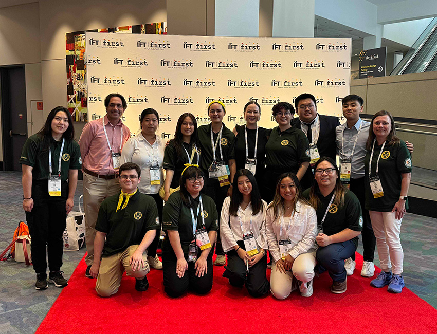 Students take a group photo during the college bowl competition