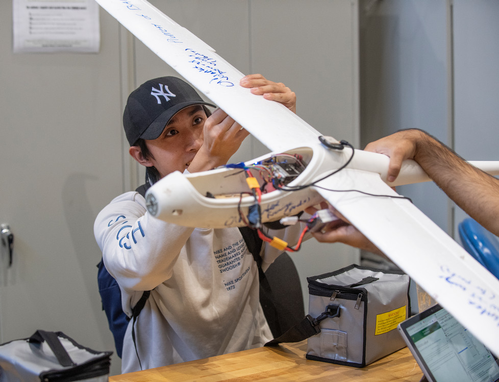 Student working with UAVs in the Lab