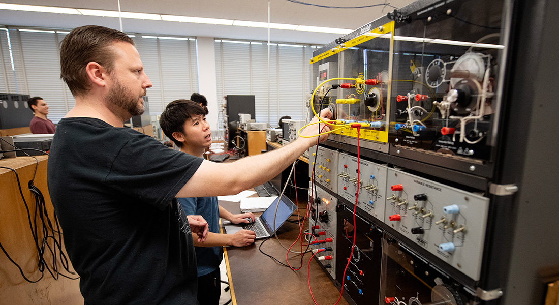 Students work on electrical system