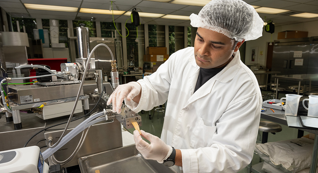 Male student working in the meat lab