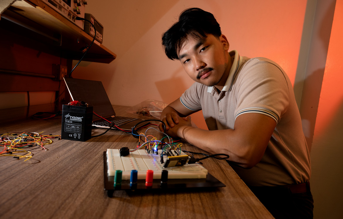 student working with engineering supplies