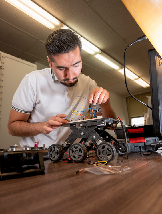 student working with electronics