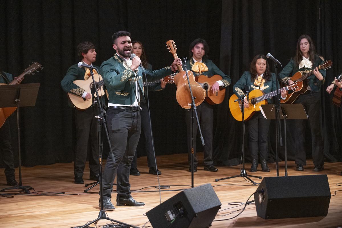Male singer performing with Mariachi Los Broncos on stage