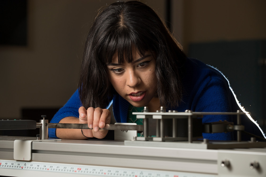student using measuring tools