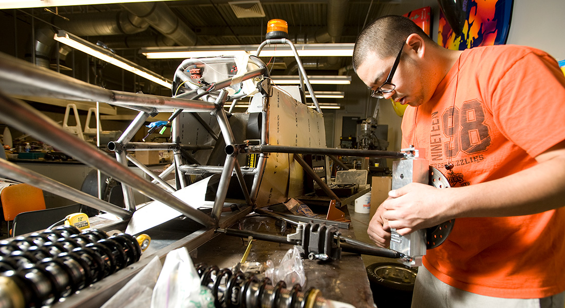 Student works on SAE hybrid car