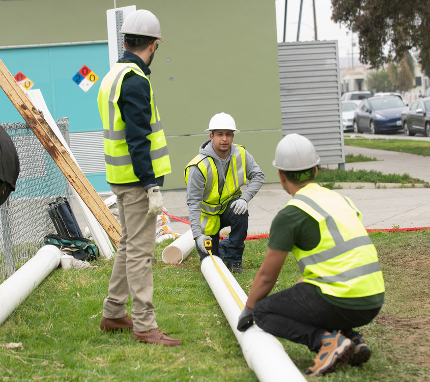 students working on well drilling project