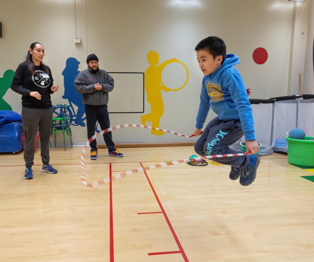 A kid jumping rope