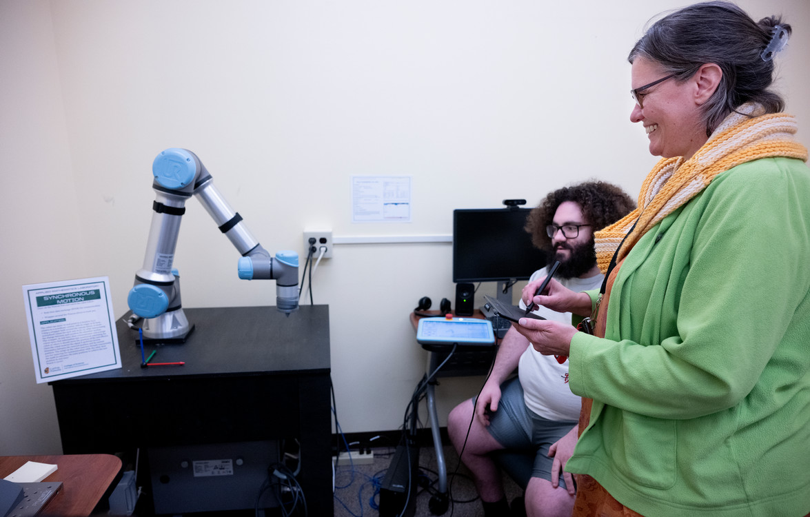 students testing the math lab robot arm