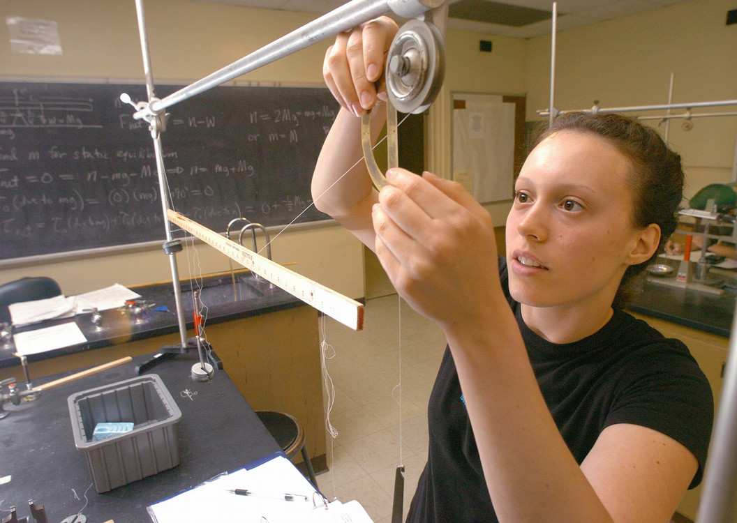 student doing an experiment