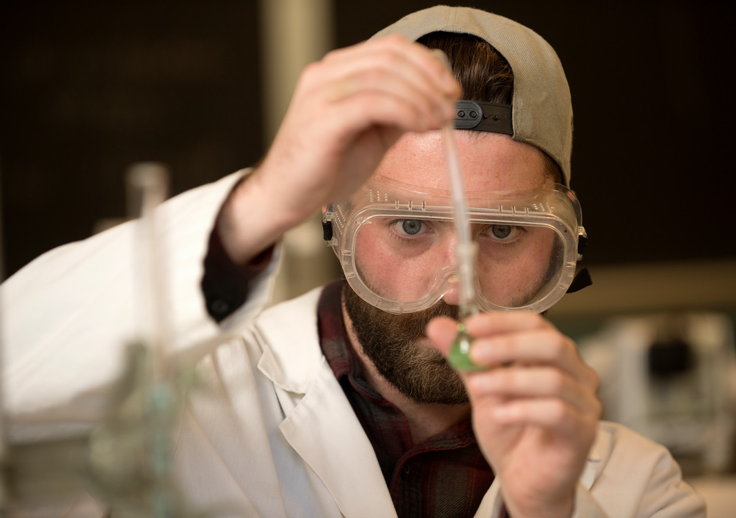 student experimenting with chemicals