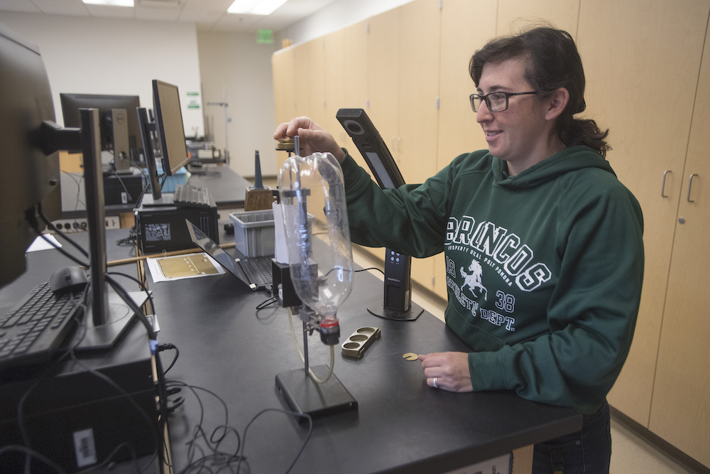 A student does an experiment with a 2 liter bottle