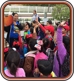 facilitator showing pumpkin plate to kids