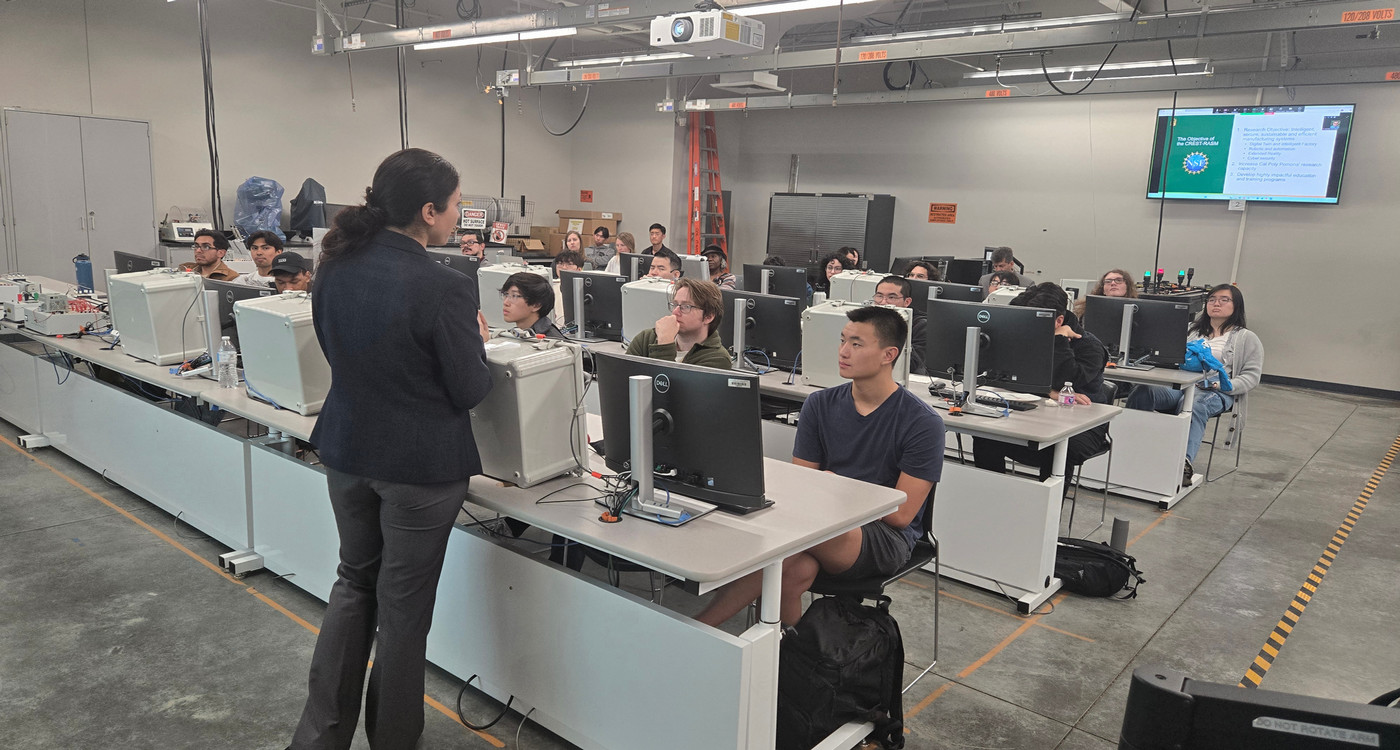 students in the lab listening to professor