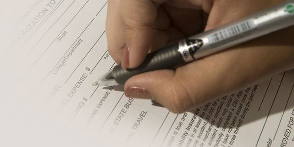 hand signing a form