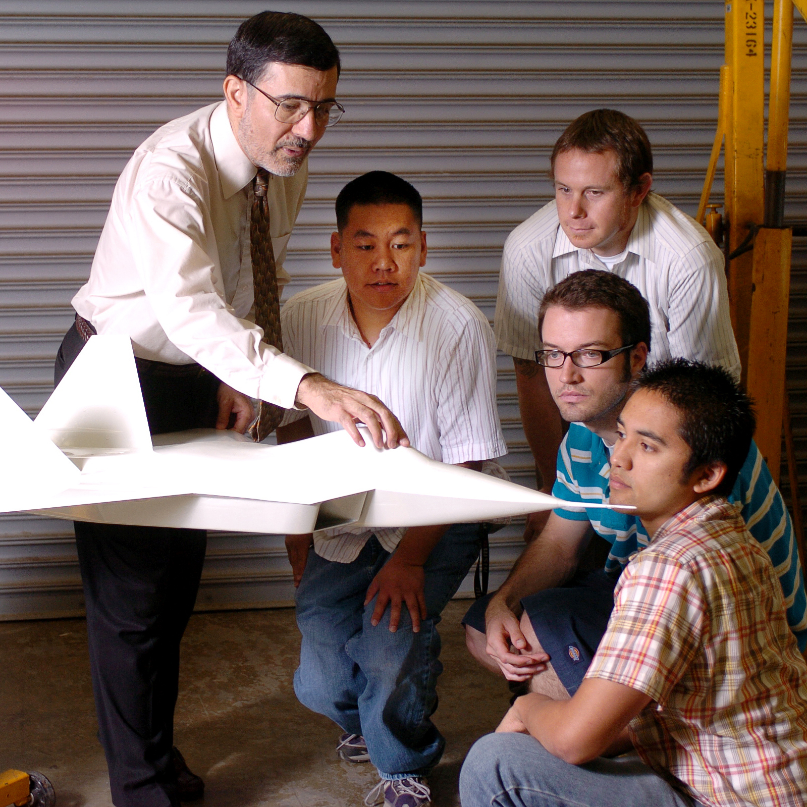 professor discussing jet model to students