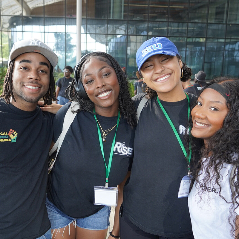 Group of students smiling during a tour of the SSB 