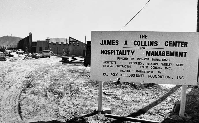Black and white photo of the construction sign in front of the Collins planned lot.