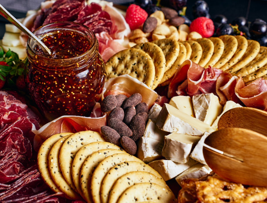 Cheese, cracker, nuts and jam board.
