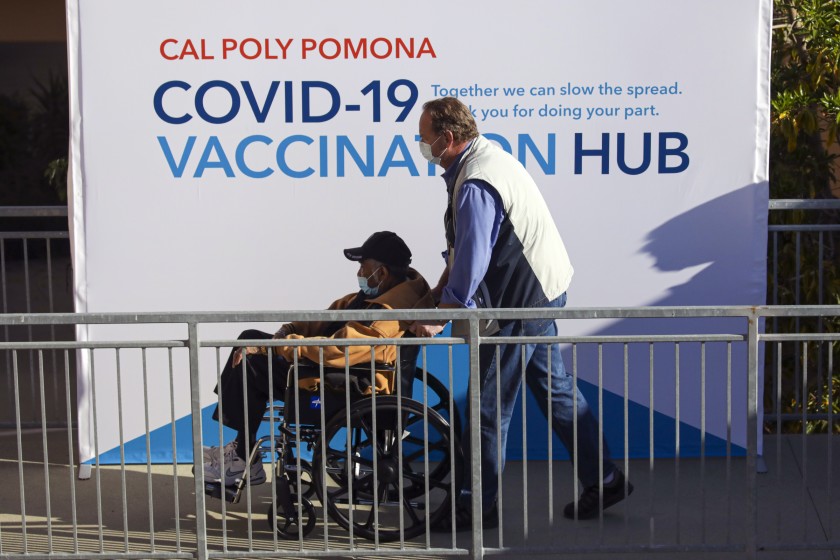 People entering the Vaccine Hub at Cal Poly Pomona via accessible ramp.