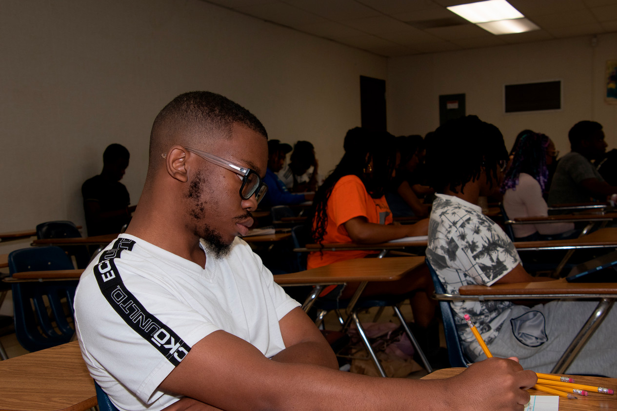 A BASES Student is interviewed on camera for a video
