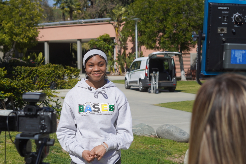 A BASES Student is interviewed on camera for a video