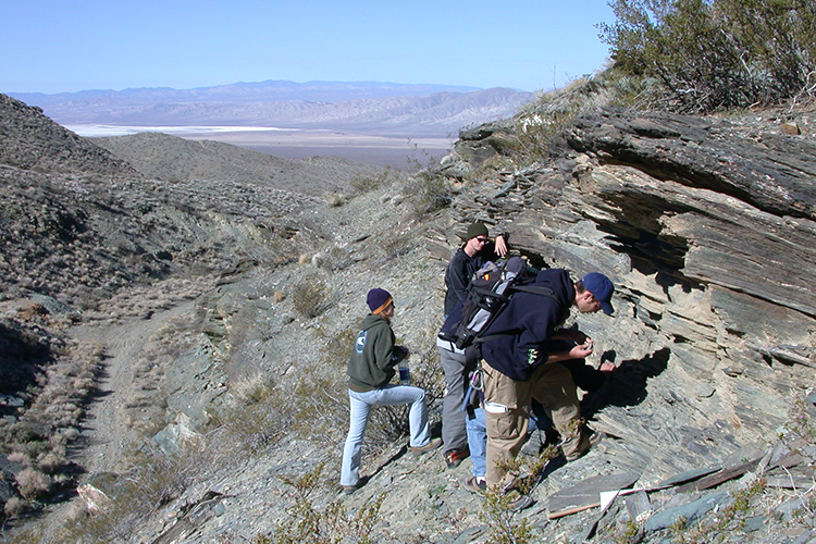 students examining rock formation