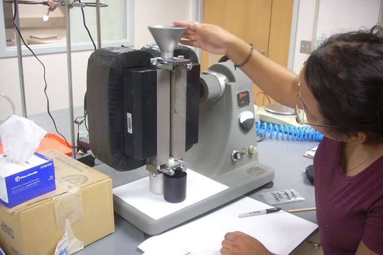 student using the Frantz Magnetic Separator
