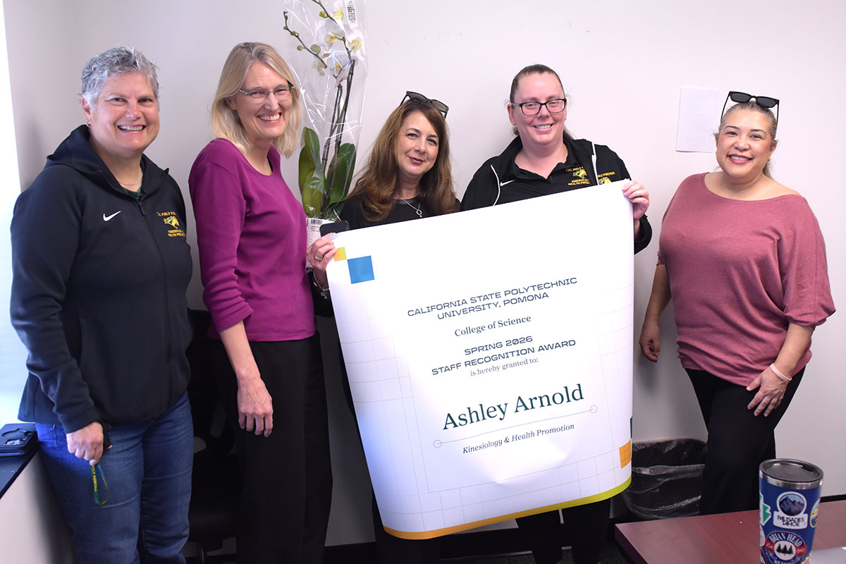 Ashley Arnold is surprised with a staff award