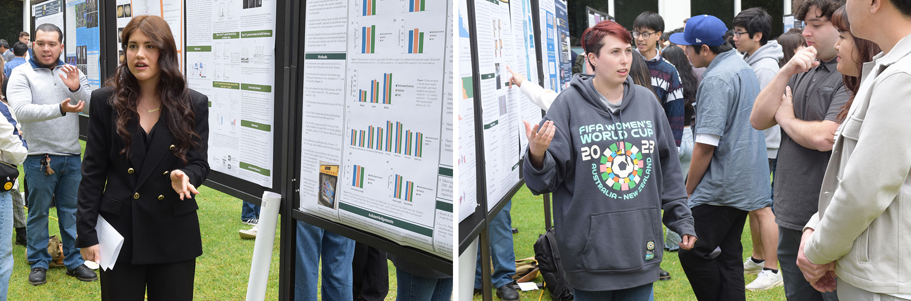 Two female science students discuss their research with visitors to the science research symposium.