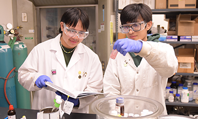 two chemistry students in a lab