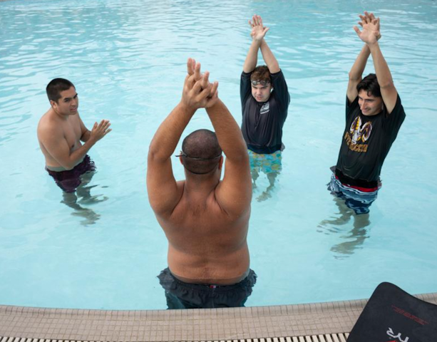 Students from Kinesiology 3130 Teaching Aquatics class work with youngsters from the Motor Development Clinic at the BRIC pool at Cal Poly Pomona.