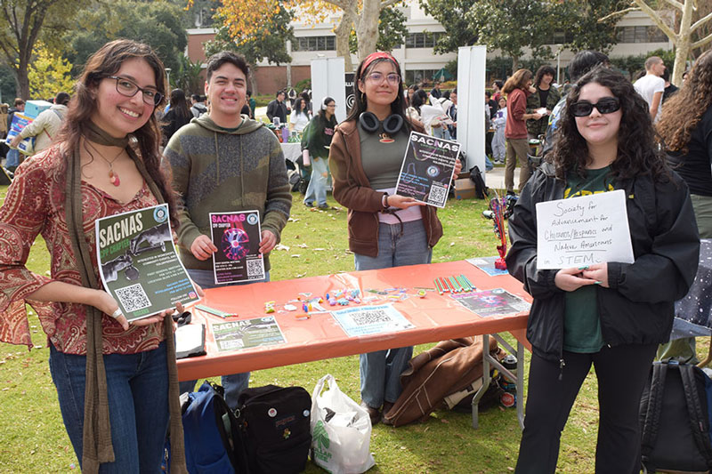 SACNAS club members table at a club fair.