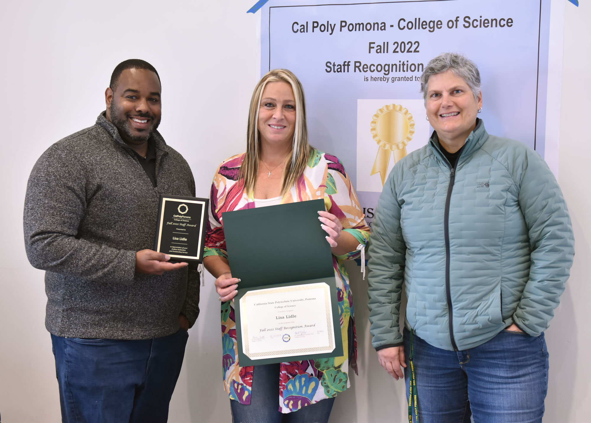 Associate Dean Michael Page joins staff award winner Lisa Lidle  and Chair Laura Chase.