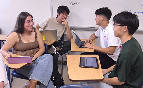 Calculus students work on a group project in class