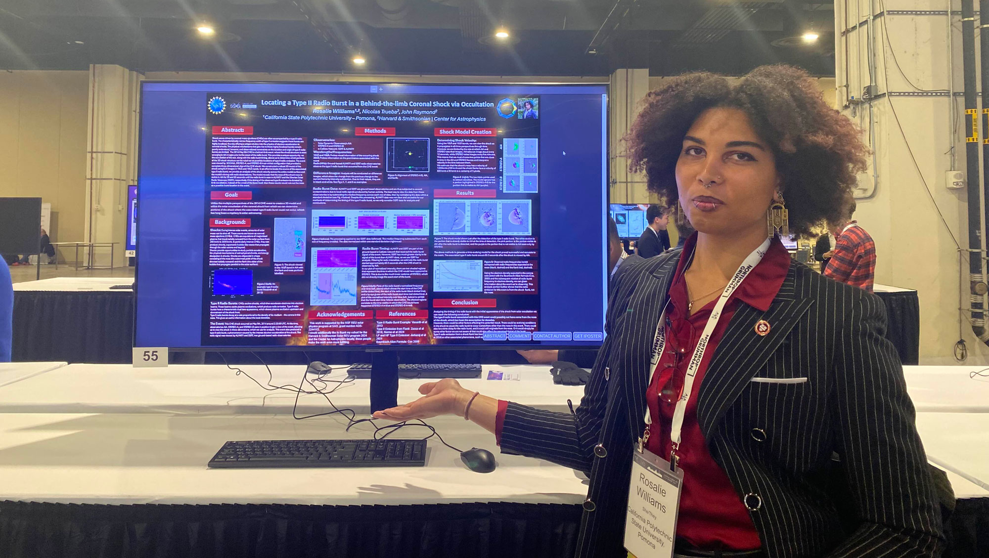 Rosalie Williams in front of her research poster