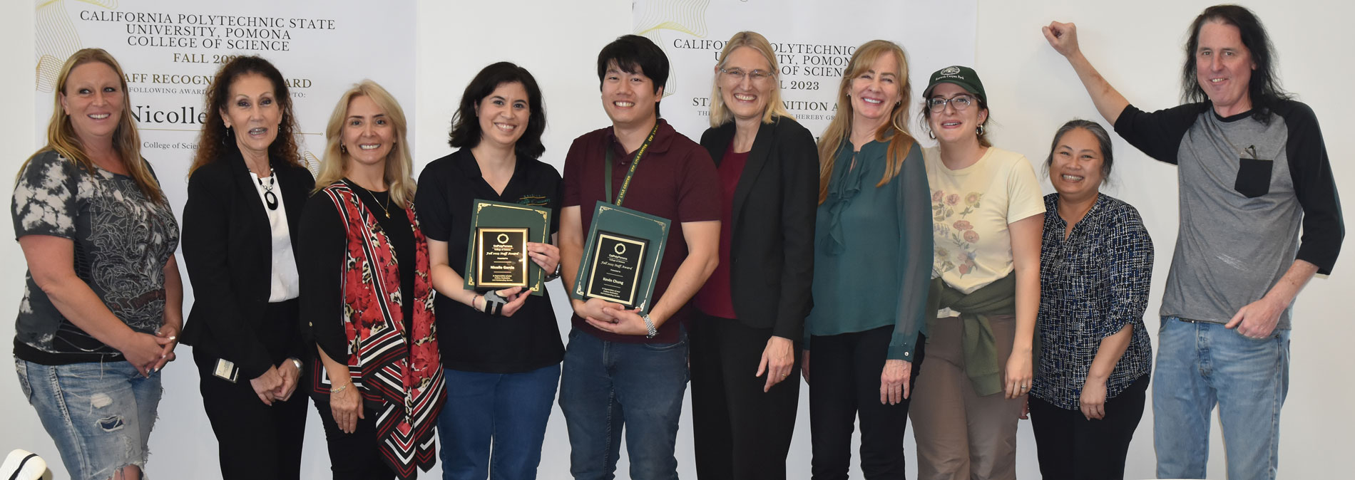 Fall 2023 staff award winners Nicolle Garcia and Kevin Chung pose with staff.