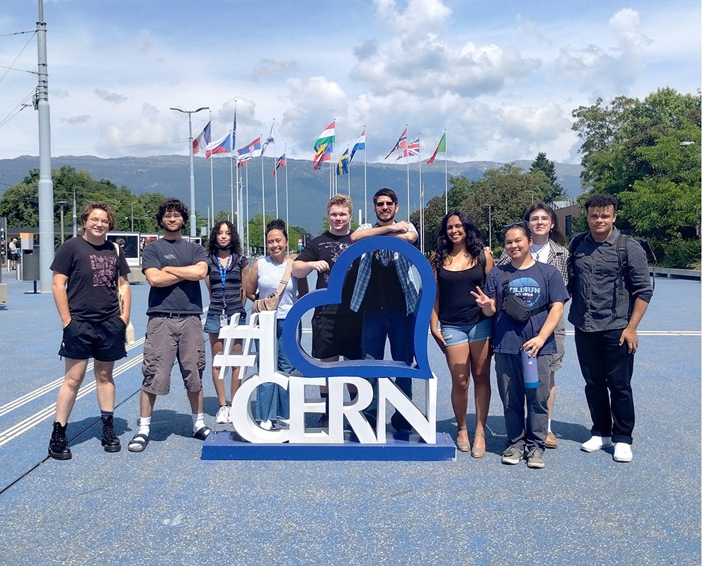 students with CERN sign