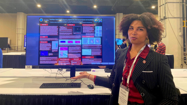 Rosalie Williams displays her poster titled "Locating a Type II Radio Burst in a Behind-the-limb Coronal Shock via Occultation".